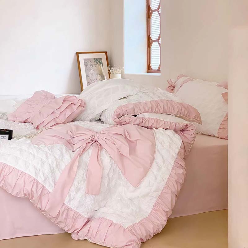 Juego de cama con textura tipo gofre y lazo fruncido rosa (sin relleno)